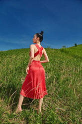 Silk pleated midi dress with sleeveless wrap bodice and flowing A-line silhouette